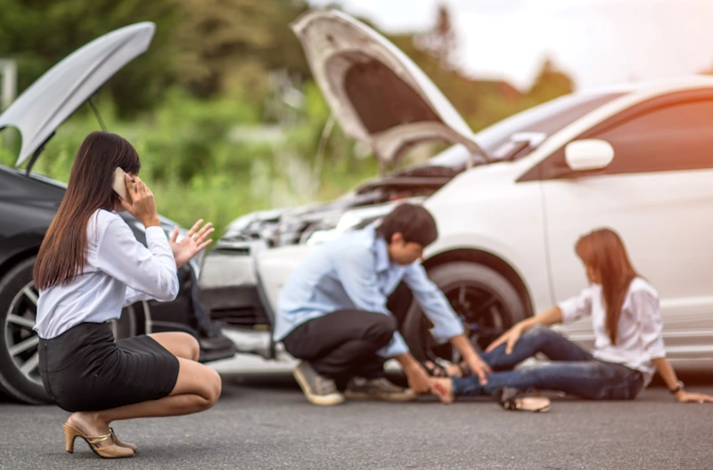 woman calling a car accident lawyer after car accident